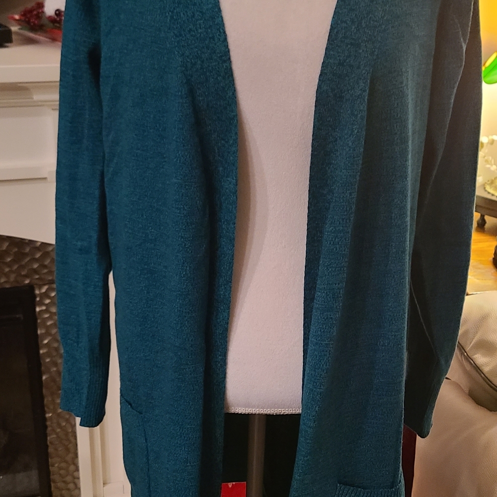 Duster style sweater with pockets.